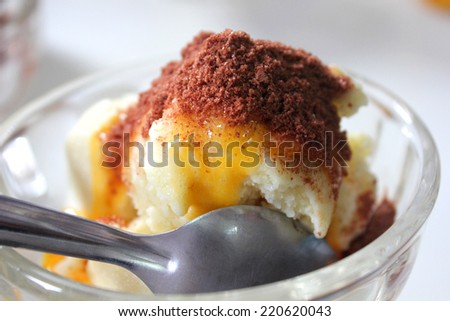 White ice cream topping with egg (yolk) and cocoa in thai style