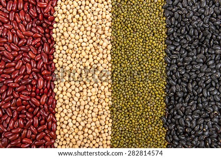 Top view background of different varieties of beans: red kidney beans, soybeans, mung beans, black beans