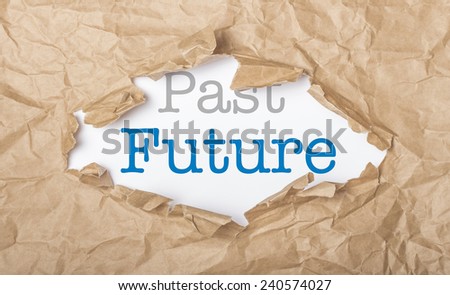Future and past words on white paper with copy space and torn cardboard