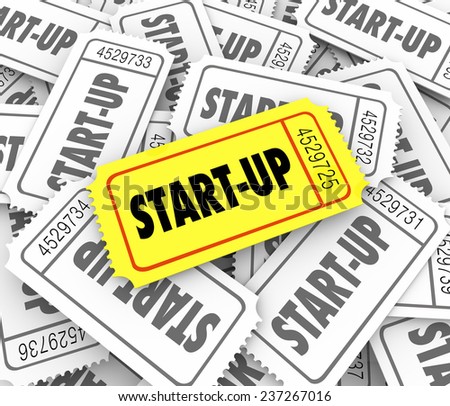 Start-Up word on a golden ticket in a pile of many competitors launching new companies or businesses and only one can be most successful