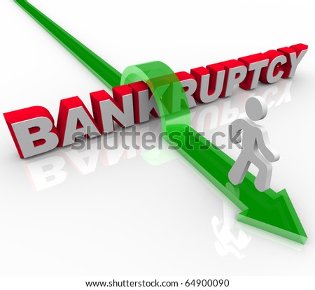 A man jumps over the word bankruptcy, symbolizing freedom from debt
