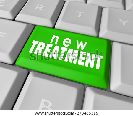 New Treatment words on a computer keyboard button to illustrate innovative help, assistance and therapy to cure your pain or discomfort