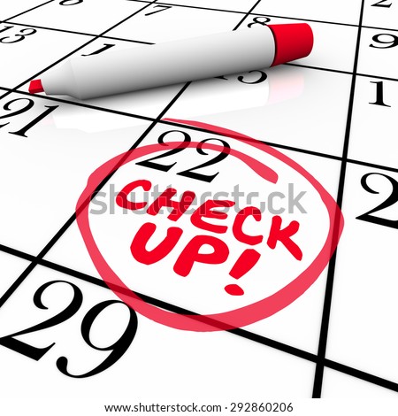 Check Up words on a calender written by red pen or marker to remind you of an exam, test or medical doctor appointment on your schedule