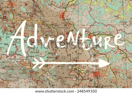Adventure written on blurred map