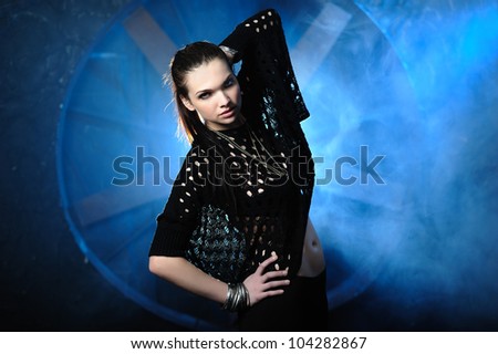 Half length portrait of classy girl against blue steam grunge background