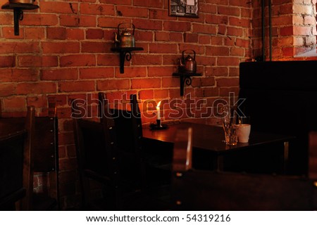 Interior of a cafe with a candle on the table