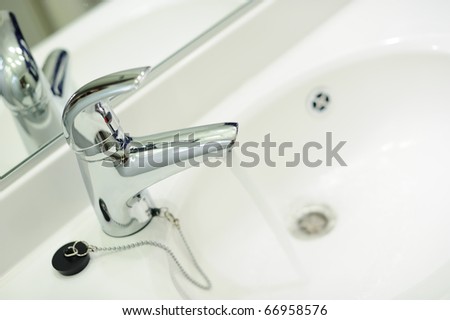 Tap with running water and a sink