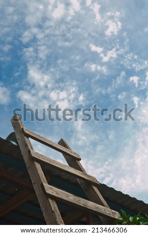 Old wooden ladder in the sky