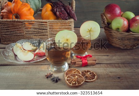 Autumn drinks with spices on the wooden table