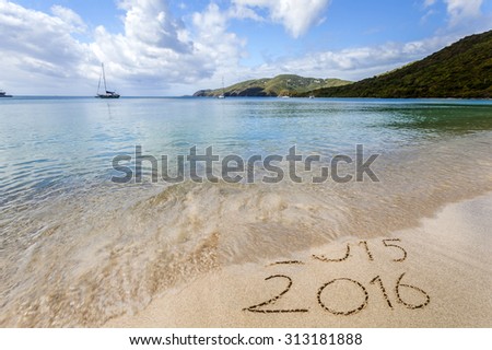 New Year 2016 is coming concept. Happy New Year 2016 replace 2015 concept on the sea beach