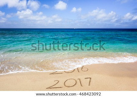 New Year 2017 is coming concept. Happy New Year 2017 replace 2016 concept on the sea beach