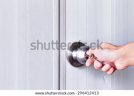 hand man with Opening door knob