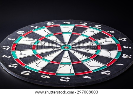 Dart board is the target and goal. Success hitting target aim goal achievement.