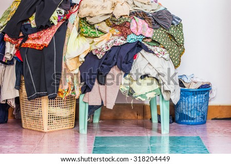 abstract The basket with not folded clothes, clothes are not wash