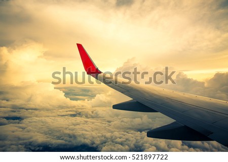 Vintage color of Morning sunrise with Wing of an airplane. Photo applied to tourism operators. picture for add text message or frame website. Traveling concept
