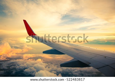 Morning sunrise with Wing of an airplane. Photo applied to tourism operators. picture for add text message or frame website. Traveling concept