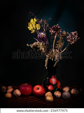 Still Life (dried food) apples wild flowers in a vase and dried walnuts