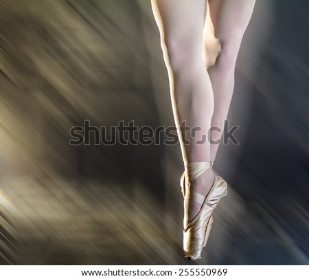 dancer legs in studio on mooved shine background