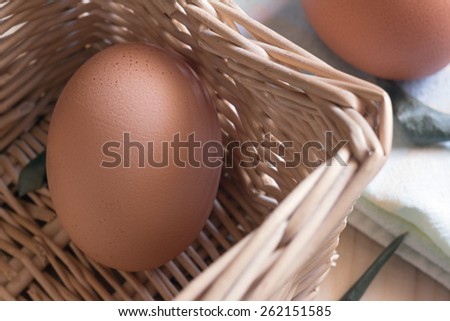 Composition of eggs in a basket with natural light