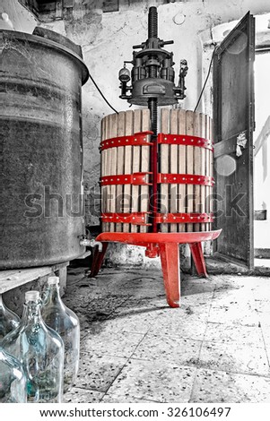 image of red wine press in black and white background