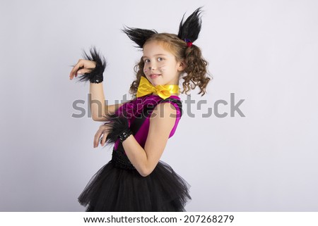 Beautiful girl in the image of a cat, in a cat costume
