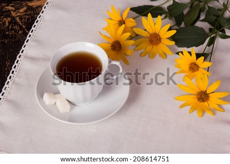 tea with sugar and yellow flowers, retro