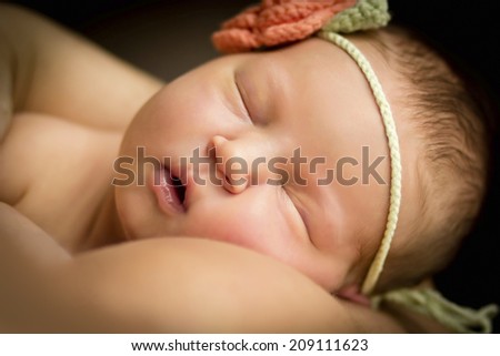 beautiful portrait of a newborn baby on his shoulder at mum, five days old