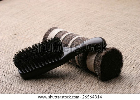 Men\'s comb. Expensive wooden comb lying on the cloth.