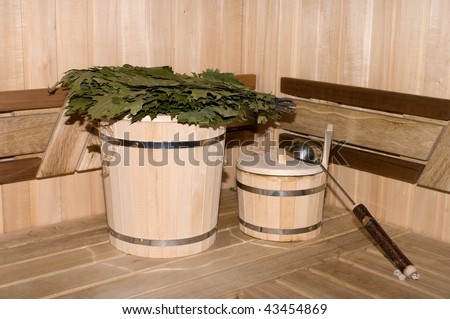 Traditional attributes of Russian bath in a sweating room interior.