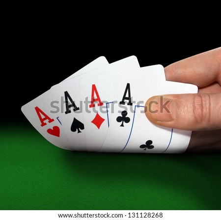 Poker of aces in hand closeup
