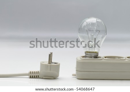 Electric lamp with extension plug-wire on light background