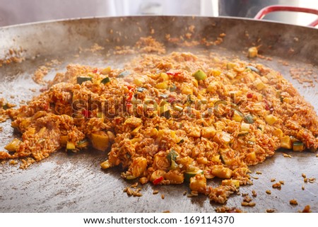Jambalaya being cooked at an outdoor food event