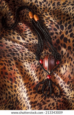 African Necklace handmade in Ghana photographed on  leopard print fabric