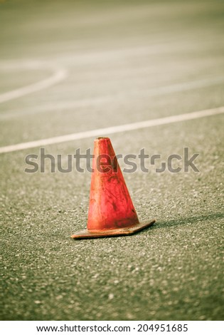Cone on a driver training course. Short depth of field.