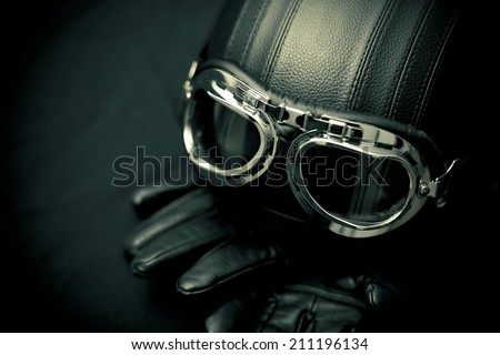Vintage motorcycle helmet with gloves and goggles