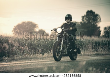 Biker riding in the sunset