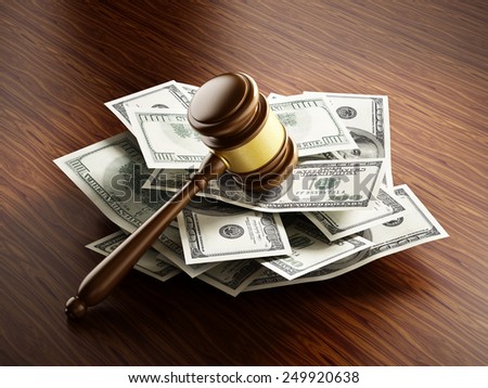 Judge gavel on 100 dollar paper money pile.