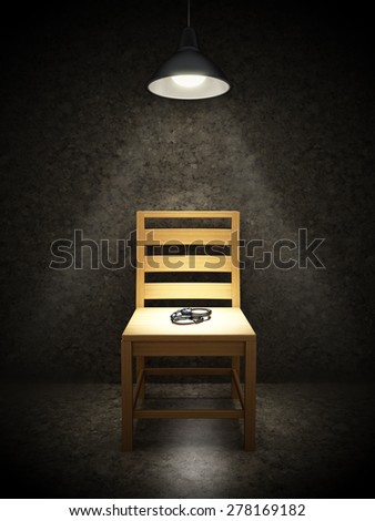 Interrogation room with one wooden chair illuminated with spotlight and handcuffs