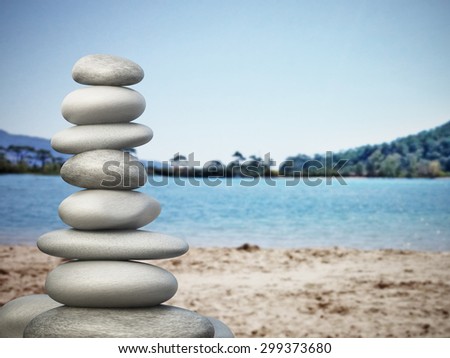 Balanced stones standing on the beach sand. Image consists of 3d rendering of stones and my own photo on the background.