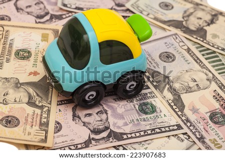 dollar banknotes with toy car