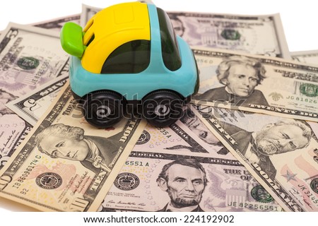 dollar banknotes with toy car