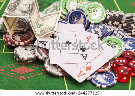 Poker chips, money,playing cards and dice