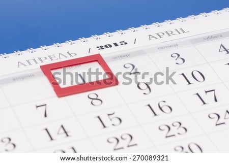 2015 year calendar. April calendar with red mark on framed date 1 isolated on blue background