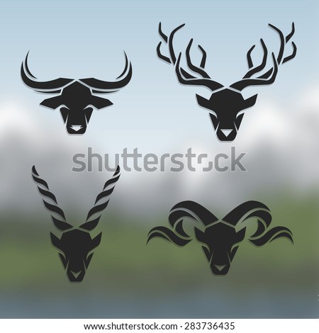 Logos horned animals On blurred background.Buffalo deer mountain goat mountain sheep Logos horned animals On blurred background.Buffalo deer mountain goat mountain sheep