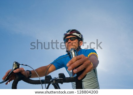 Picture of a man riding a racing bicycle