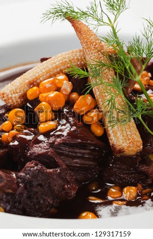 Peruvian food beef in sauce with corn
