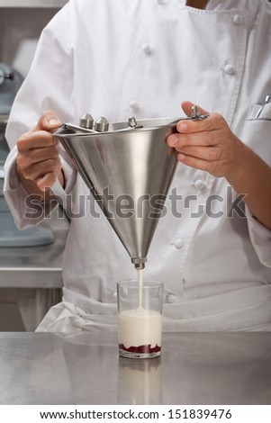 chef preparing a custard dessert and chocolate