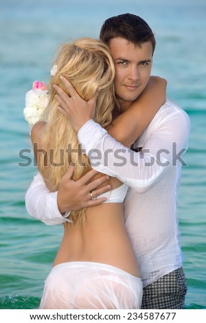 Couple in love on a background of the ocean