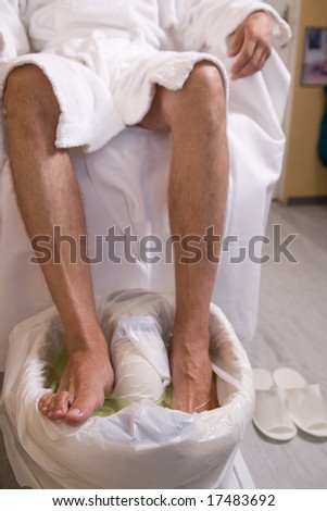 a man and  the procedure of pedicure