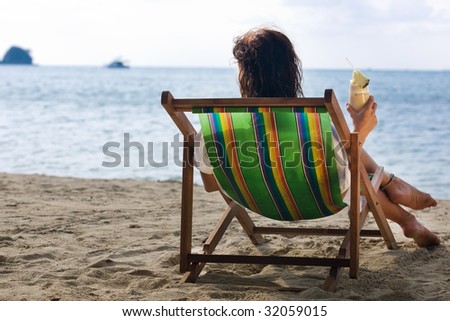 Single woman in chair. Ko Mah island. Thailand. Asia.